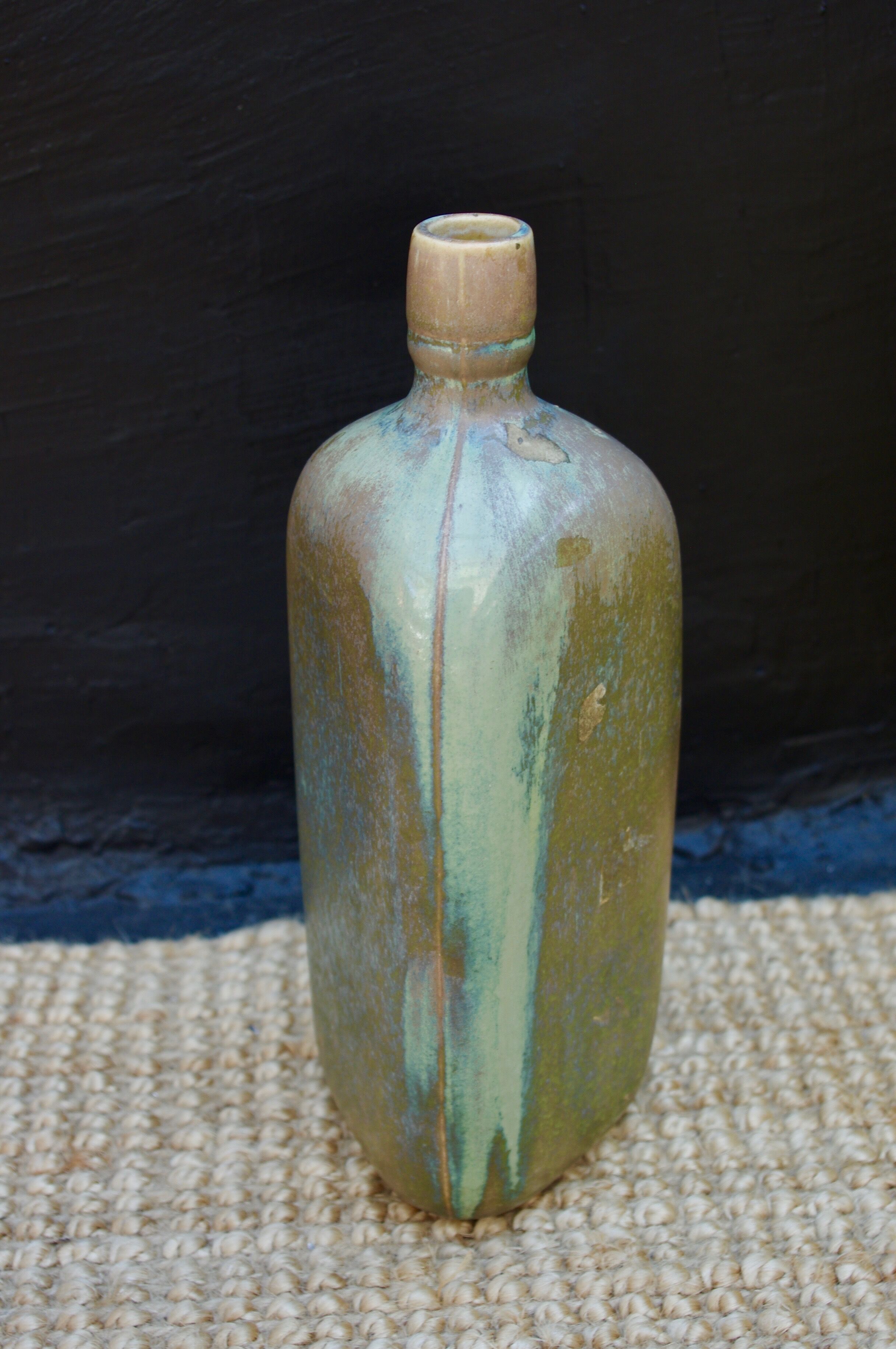 sandstone triangular bottle