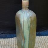 sandstone triangular bottle