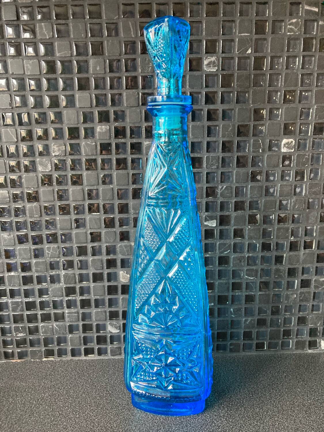 Blue chiseled glass bottle