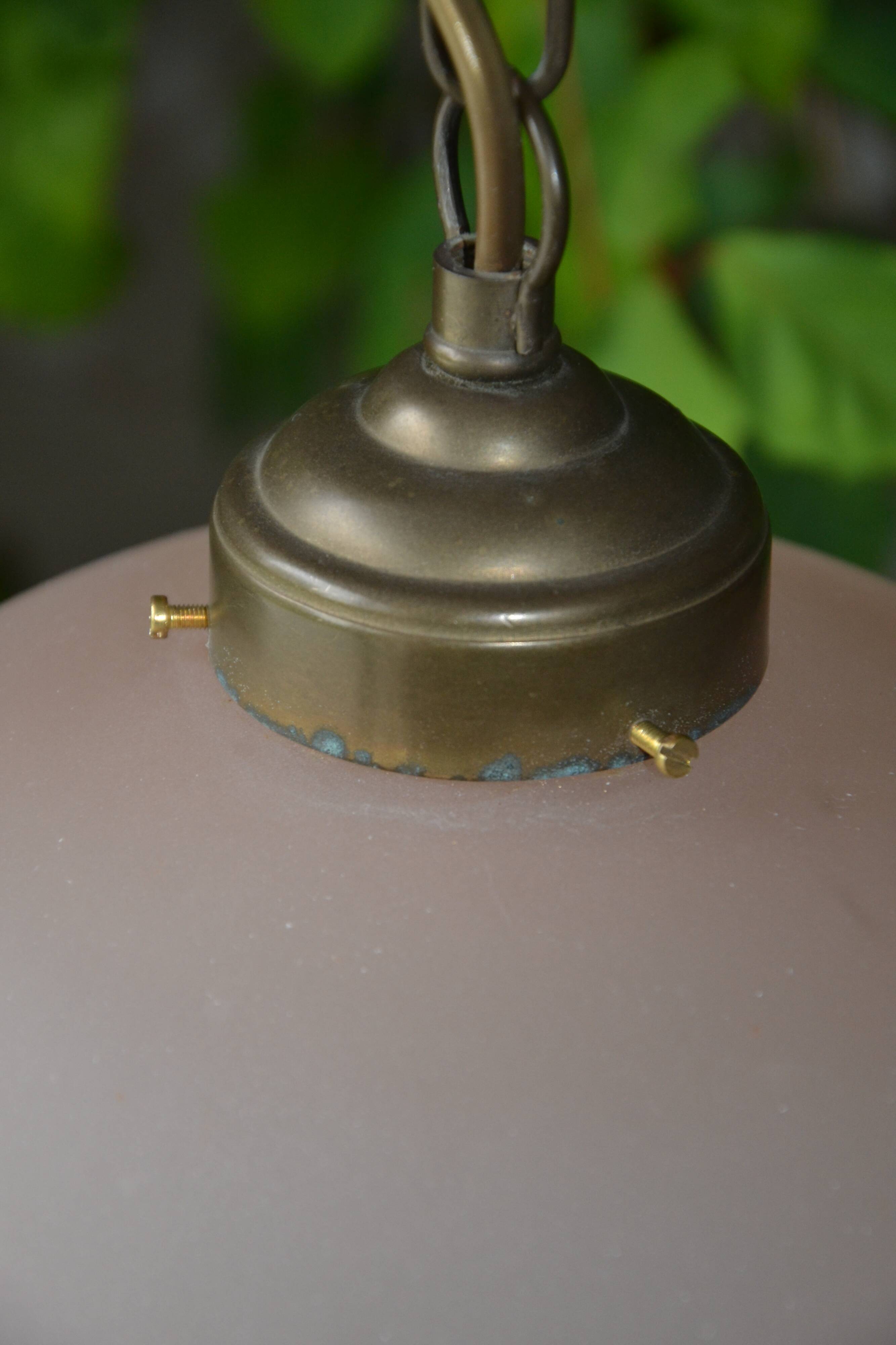 Lustrous suspension in glass paste, glass and ceramic pendants.
