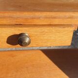 Magazine rack with sliding drawers in light wood, Scandinavian style.