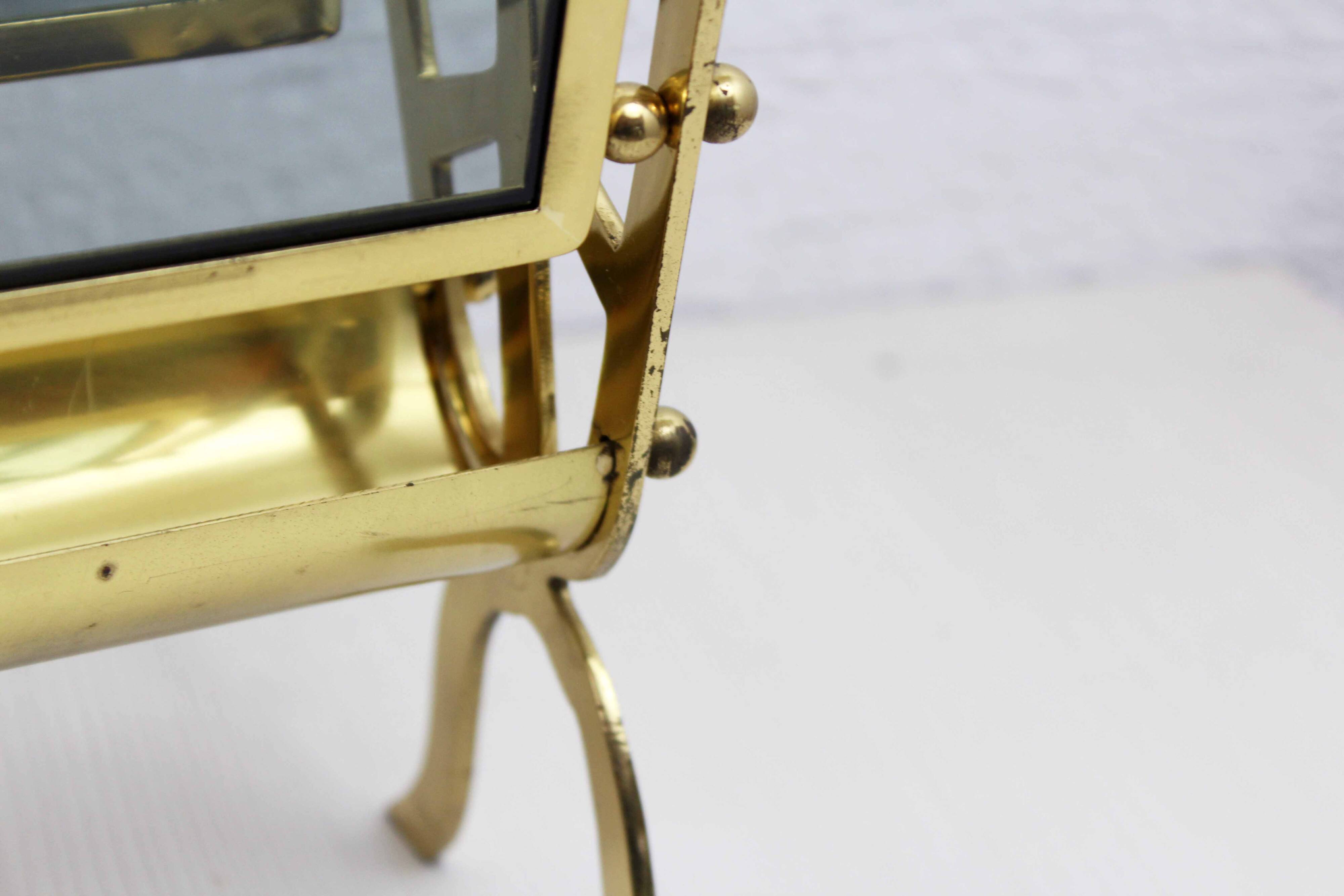 Glass and brass magazine rack, 1970