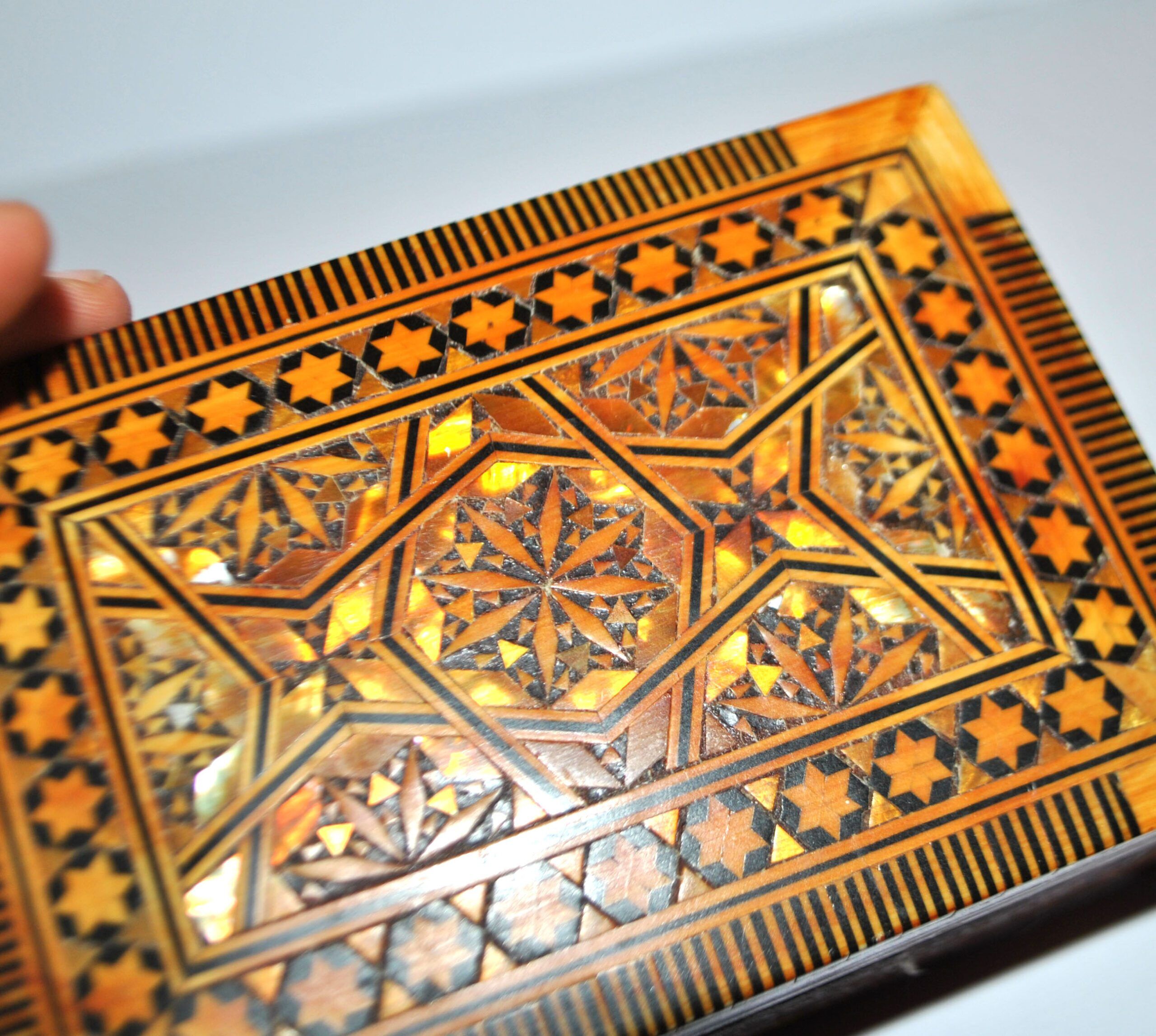 Vintage wooden box with straw marquetry and mother-of-pearl decoration.