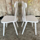 Pair of vintage white wooden bistro chairs