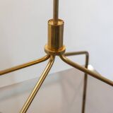 Free-standing shelf in gilded brass with smoked glass shelves. 1970s.