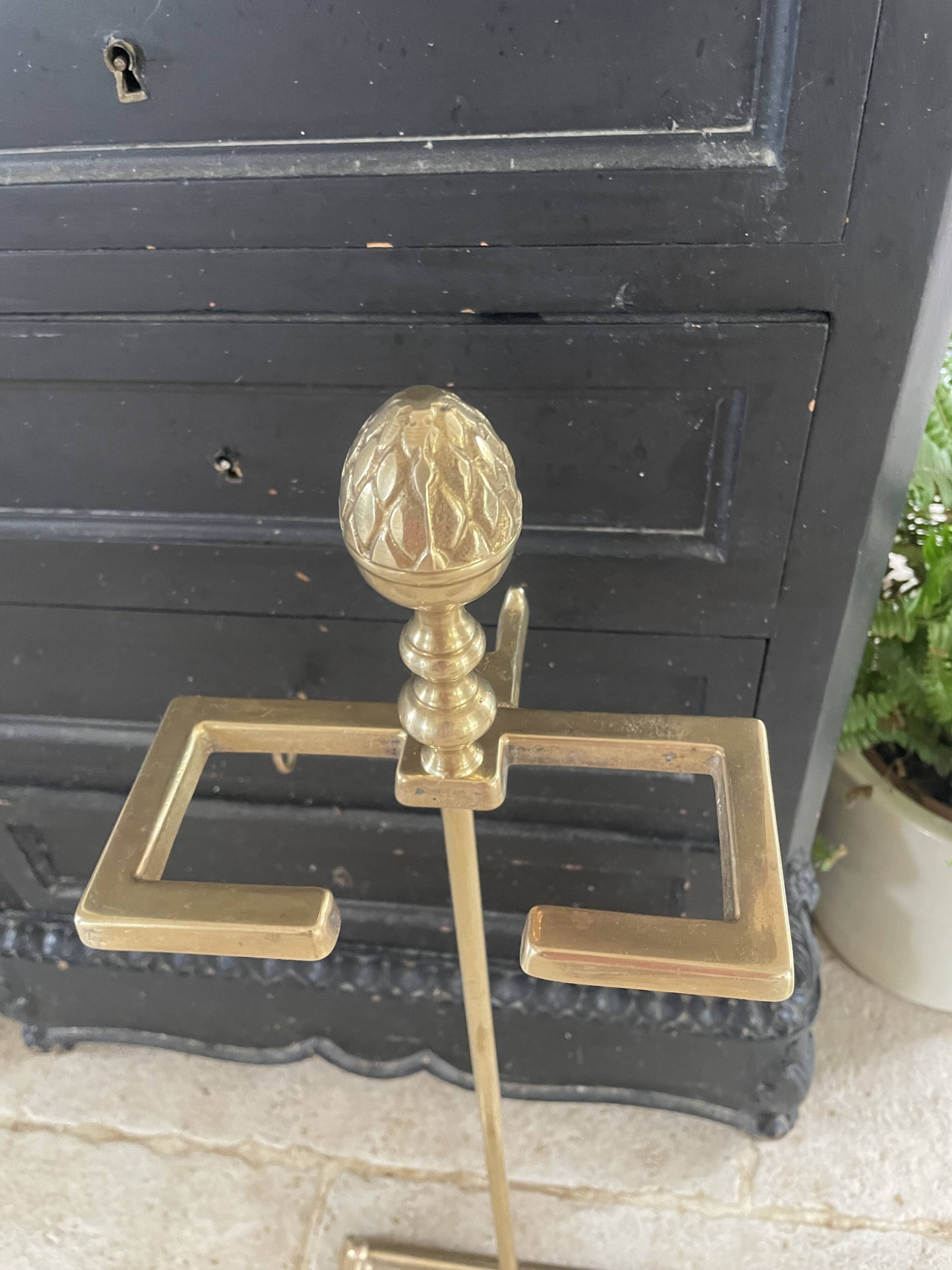 Brass fireplace tools in the style of Maison Baguès.