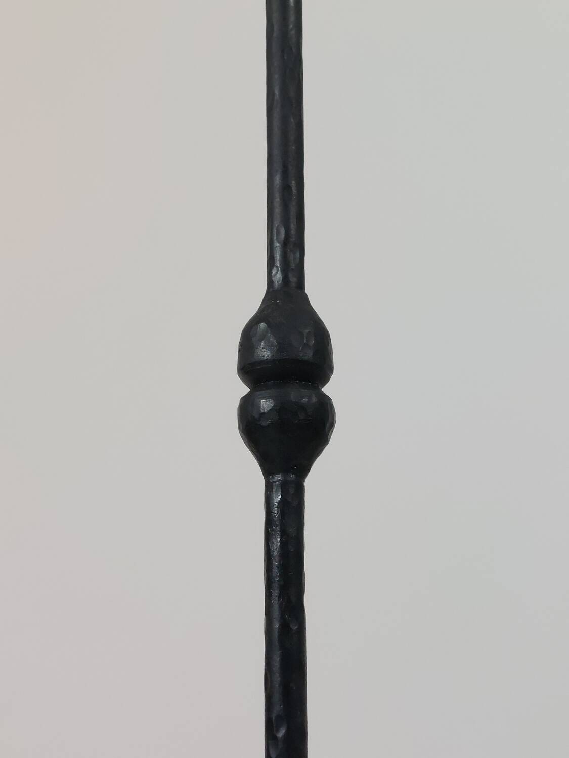 A pair of beautiful and exquisite vintage wrought iron candlesticks from the mid-century.