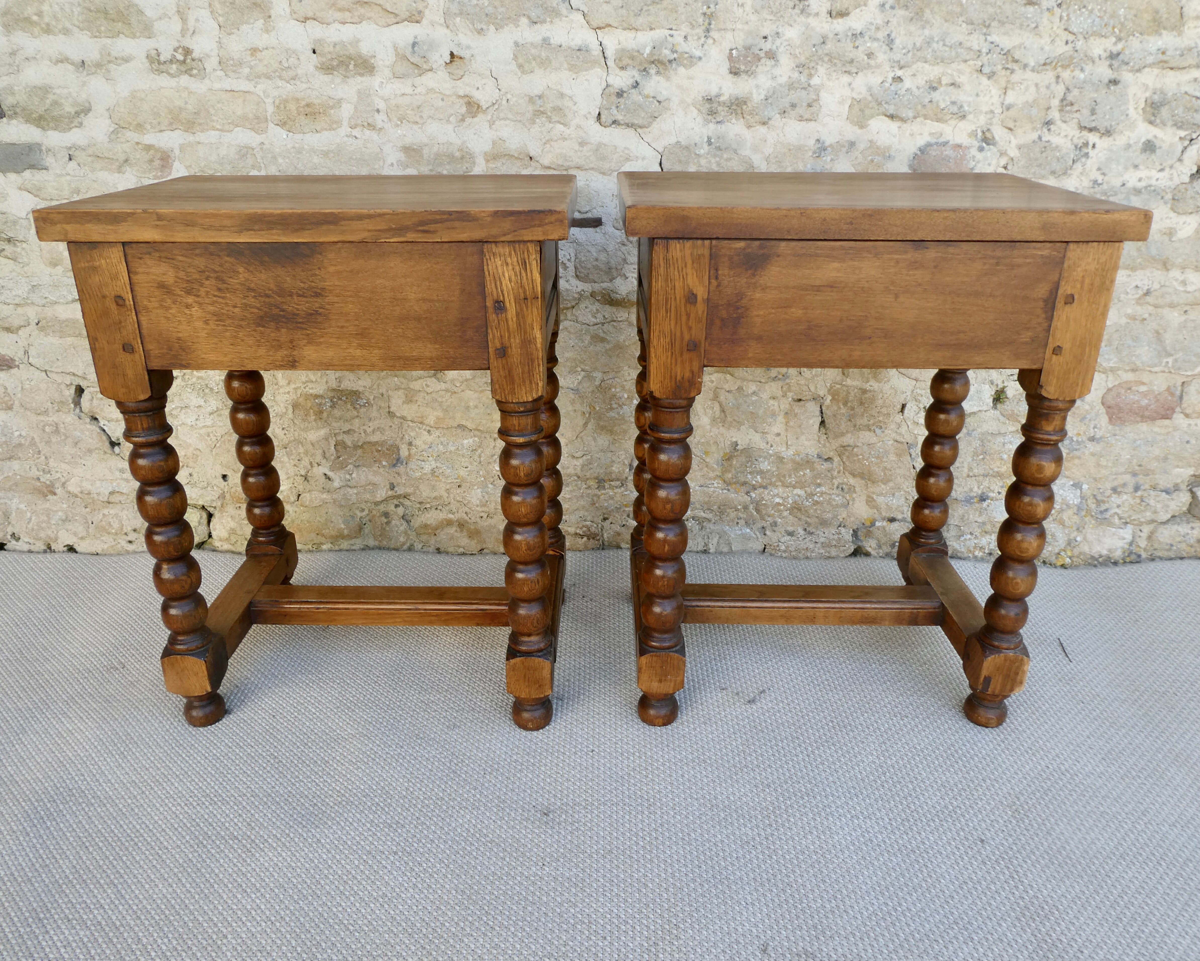 Pair of solid oak bedside tables with carved legs