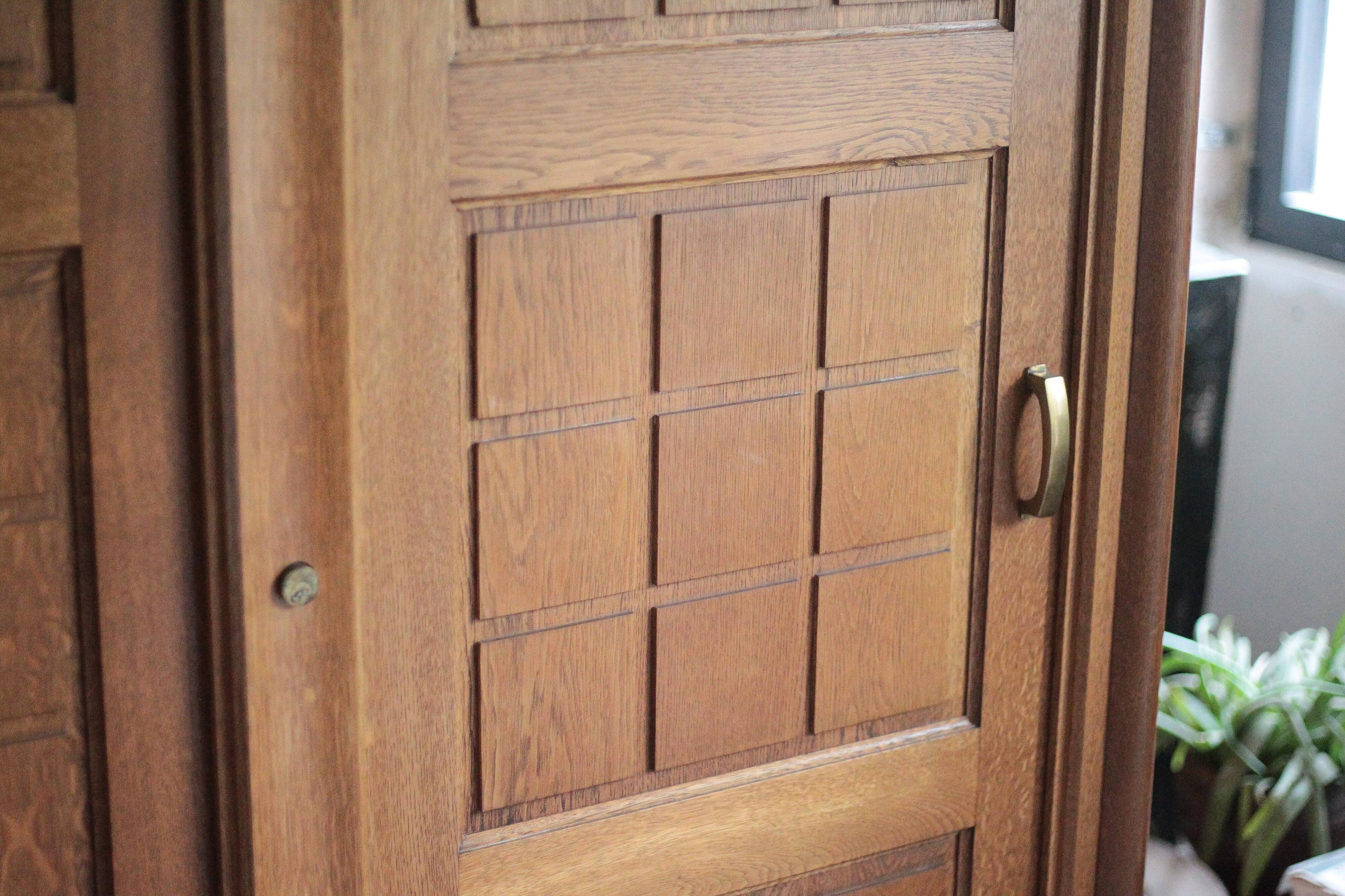 Vintage wooden wardrobe with sliding doors.