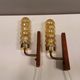 A set of Danish wall lights in champagne coloured glass with brass and teak.