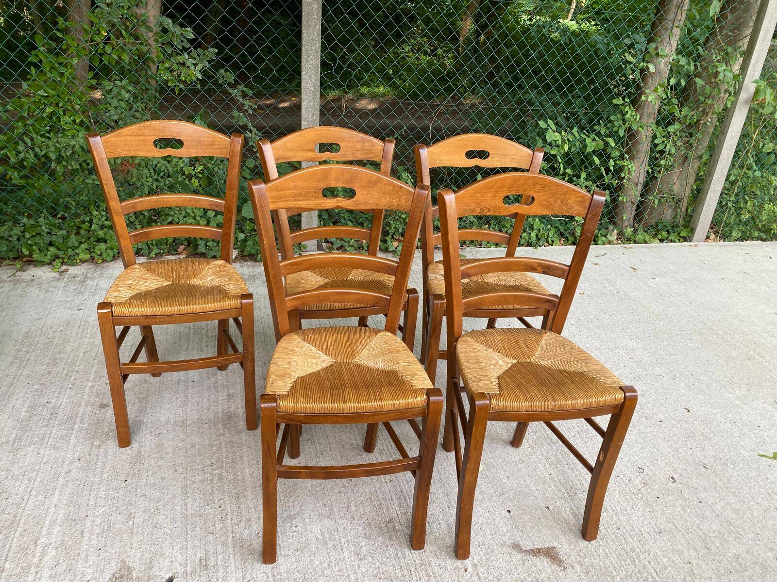 12 solid wood and straw chairs