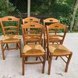 12 solid wood and straw chairs