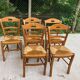 12 solid wood and straw chairs