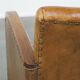 Cognac-colored sheepskin and wooden Art Deco design armchair