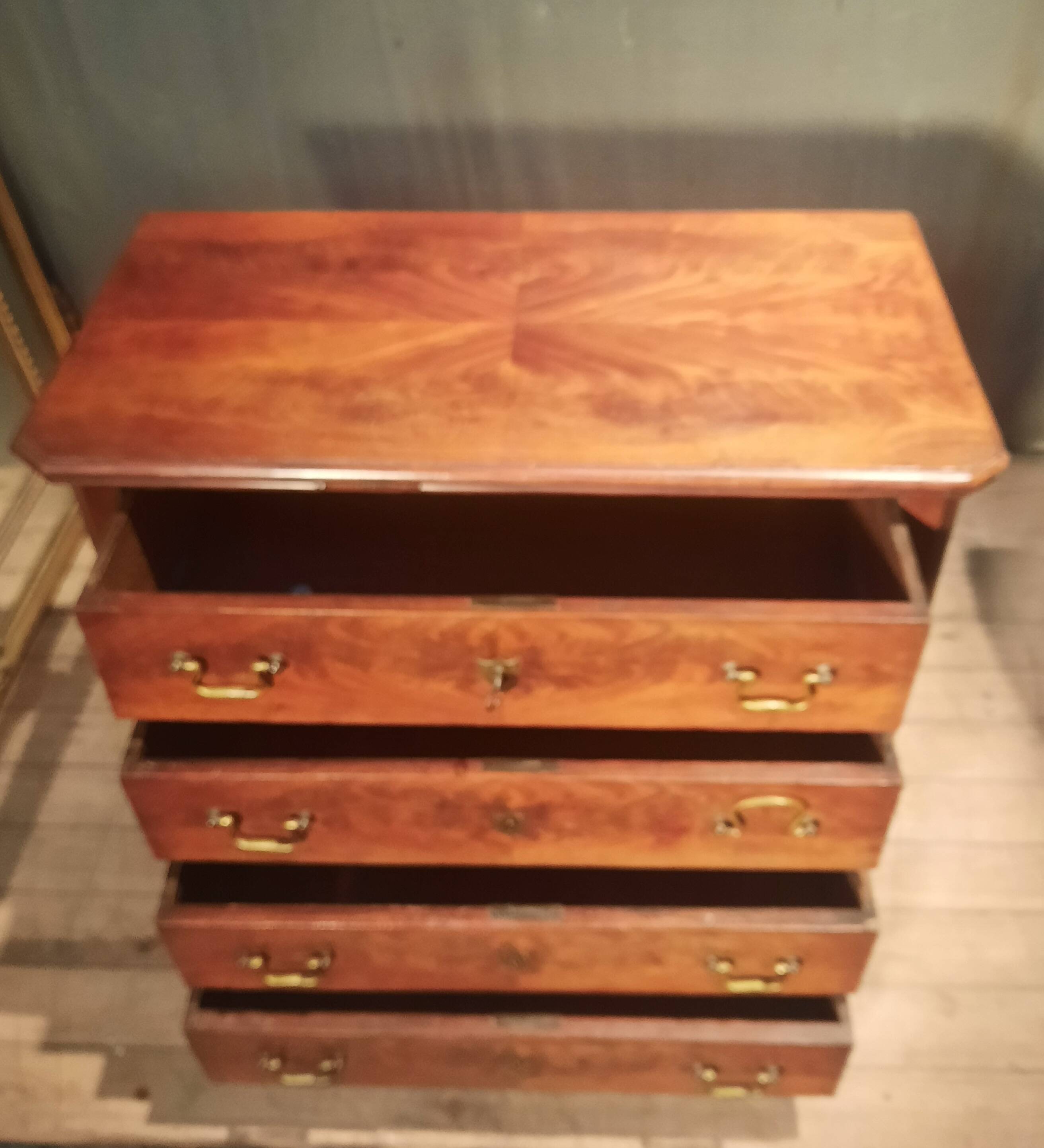 Small Louis Philippe chest of drawers with cut corners.