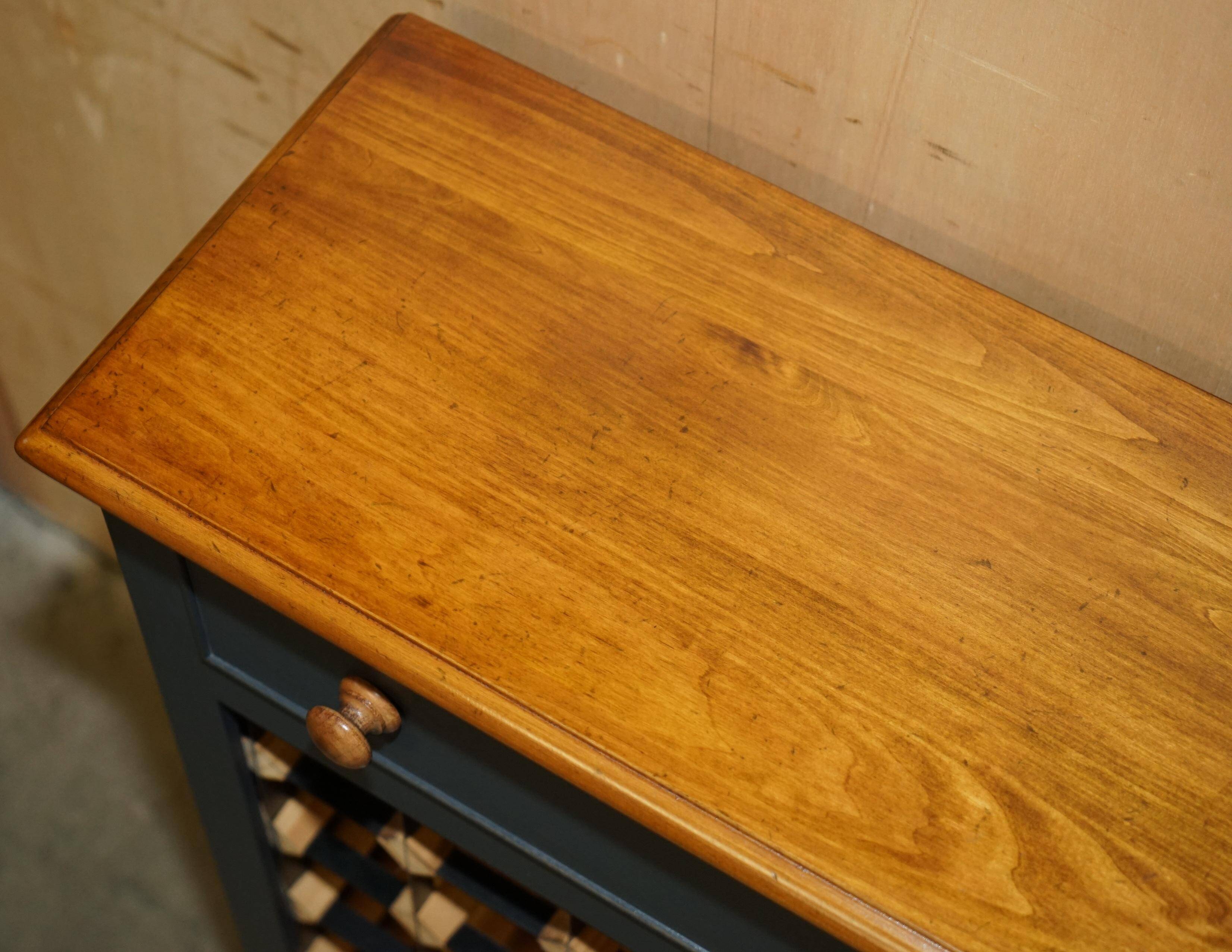 Vintage wine rack furniture for 36 bottles with drawer.