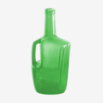 Demijohn in green glass