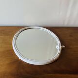 Oval mirror in vintage enameled white cast iron