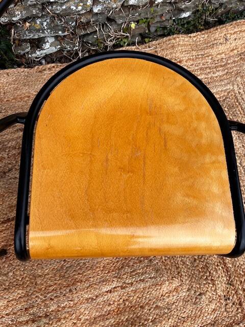 Pair of wooden and black metal chairs