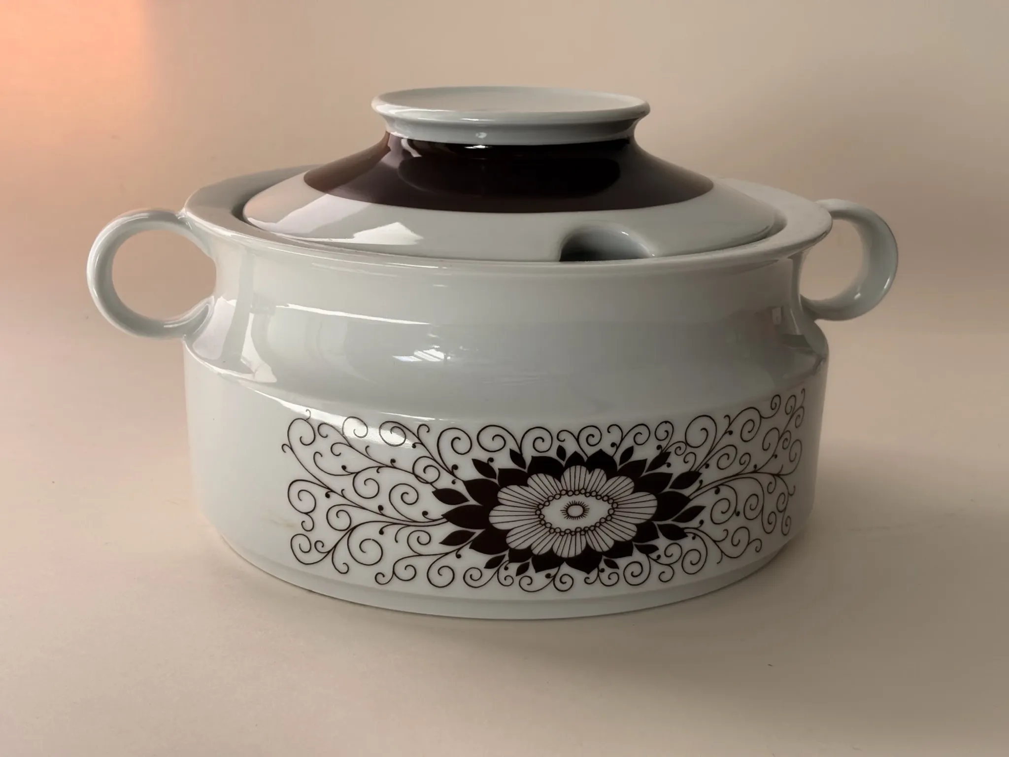 Porcelain soup tureen by Winterling, decorated with brown flowers.