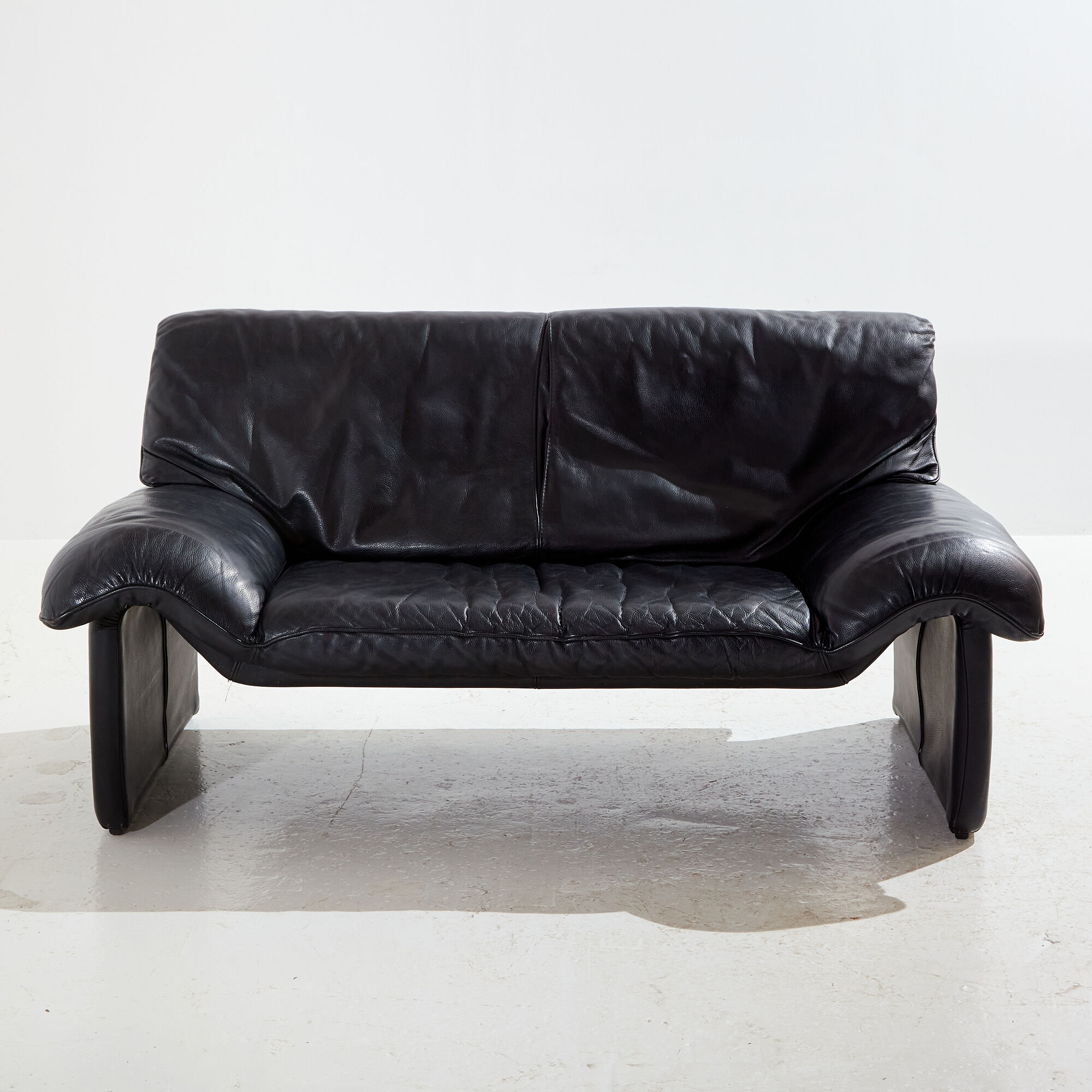 Two-seater leather sofa