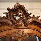 Large wooden display cabinet in Louis XV/rococo style with a strongly curved front.