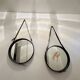 Jacques Adnet pair of circular leather and brass mirrors