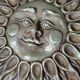 Anthropomorphic sun wall sculpture in patinated terracotta, vintage Italian craftsmanship.
