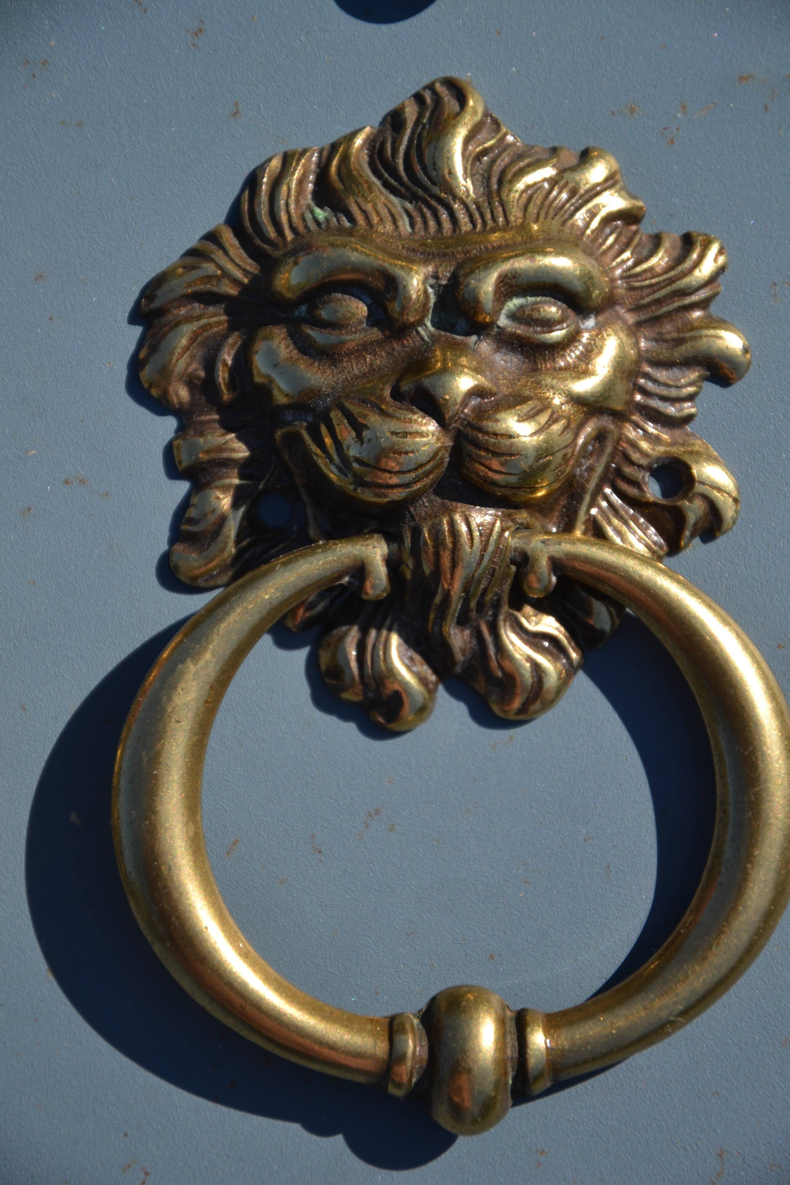 4 antique lion head furniture handles from La Samaritaine.