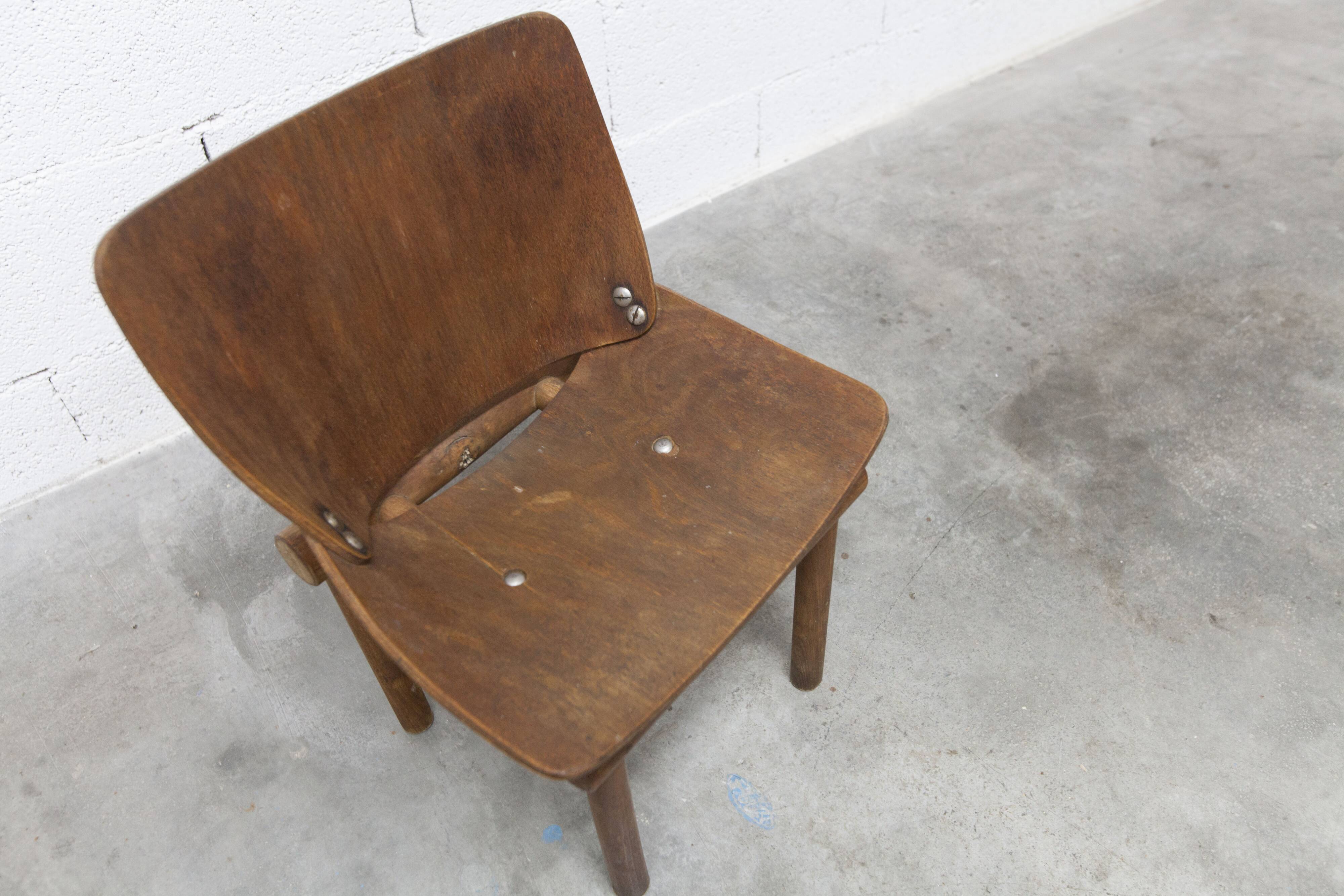 Atypical 1960s curved wood children's chair