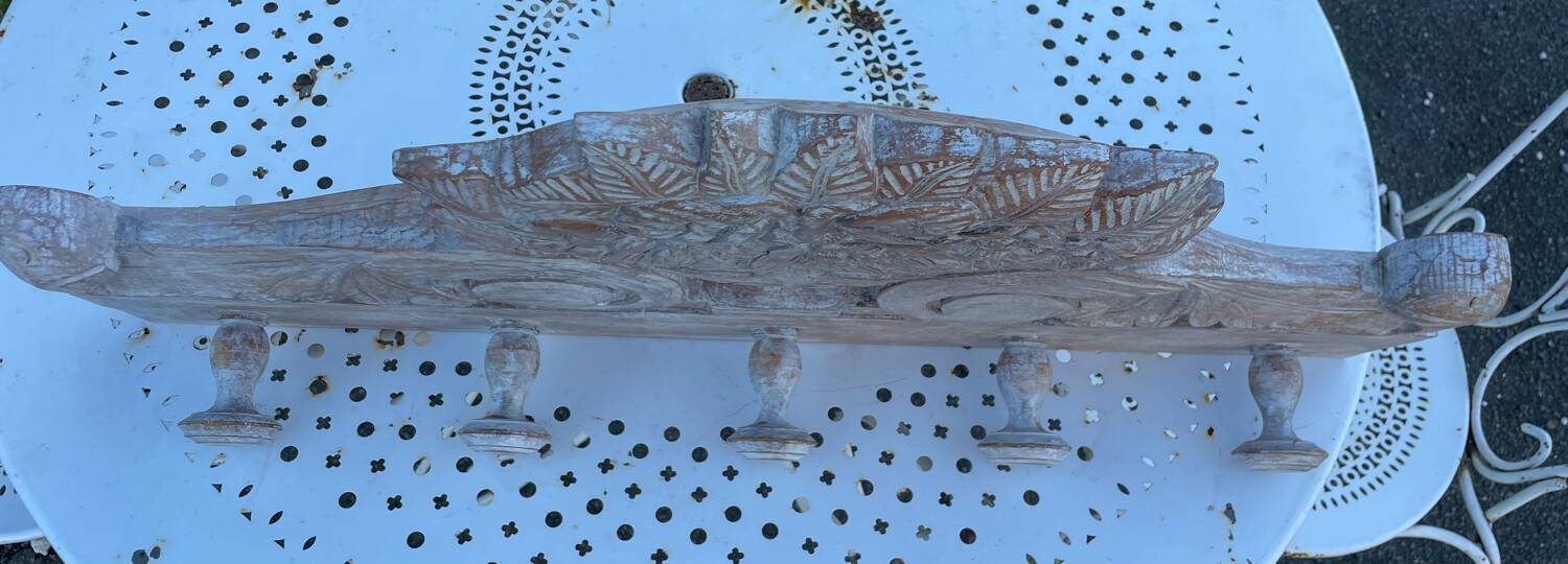 Raw carved wood coat rack