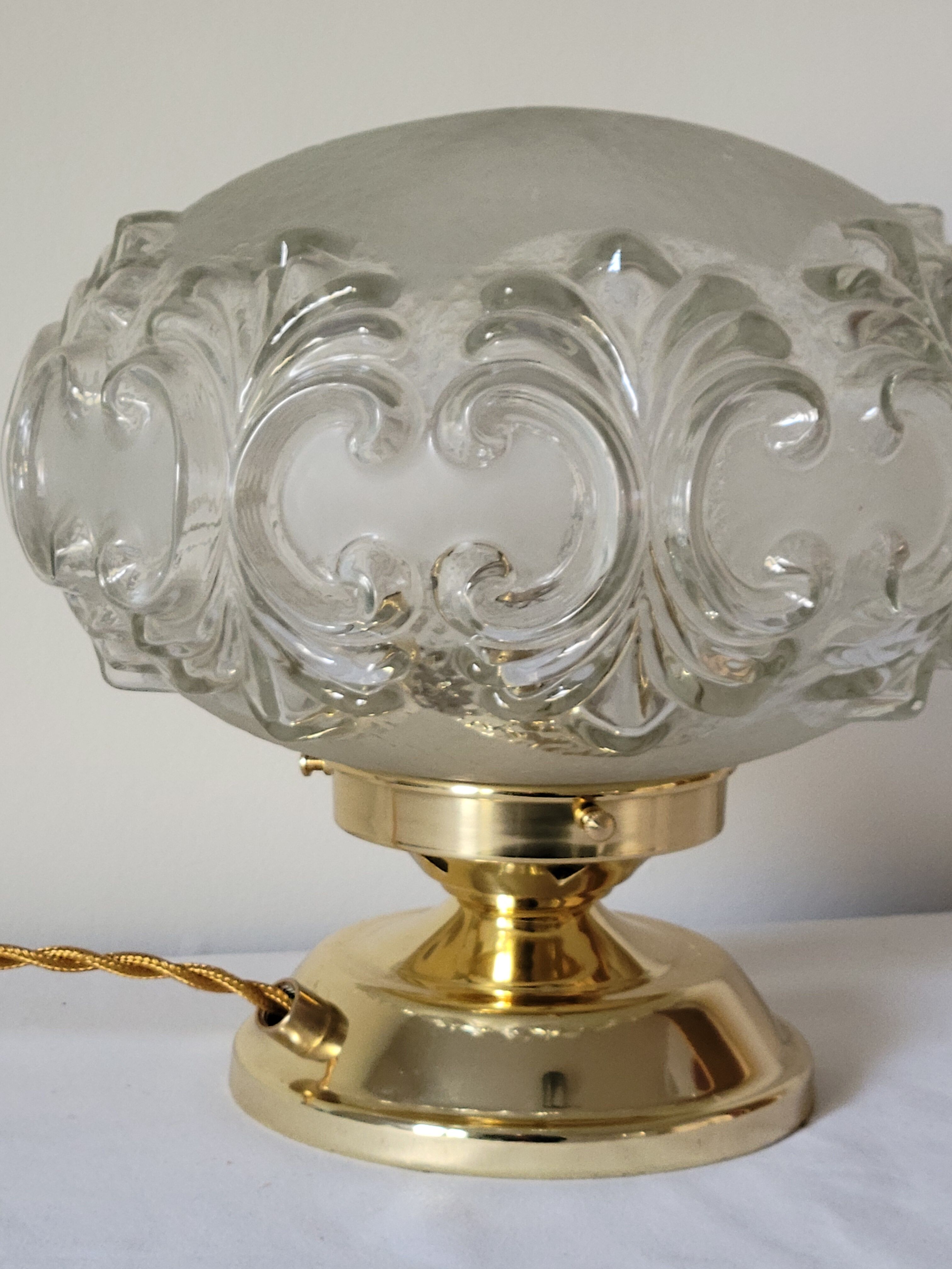 Brass lamp with molded glass globe
