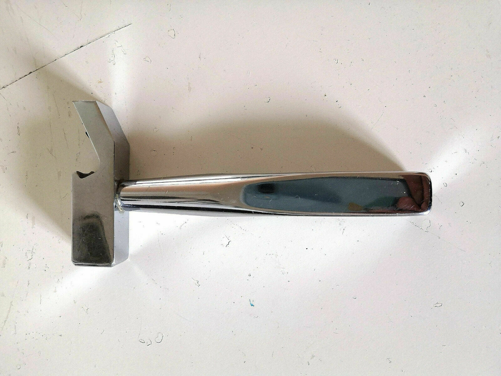 Ice pliers and ice hammer by Jacques Adnet