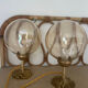 2 bedside lamps with round amber glass globes and gold metal.