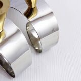 Pair of chromed metal and brass candlesticks