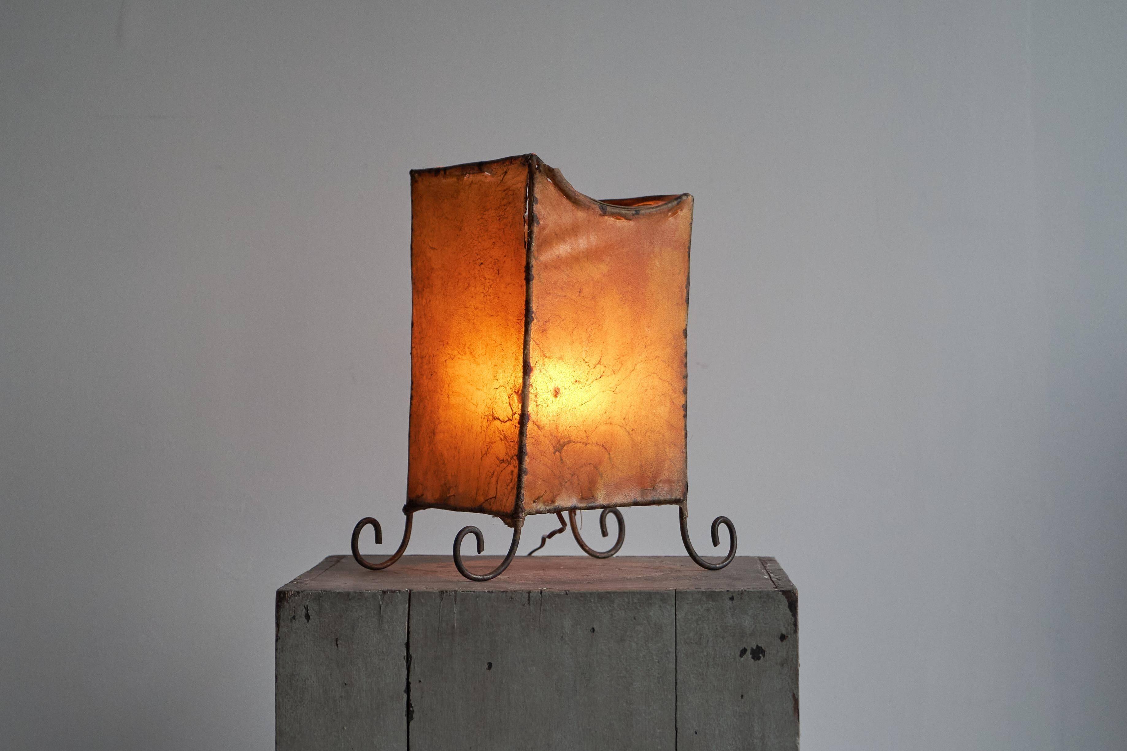 Mid-century table lamp in goat leather and wrought iron, 1950s
