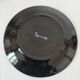Black faience plate with stylised fish, Ty Breiz spirit from the 1960s.