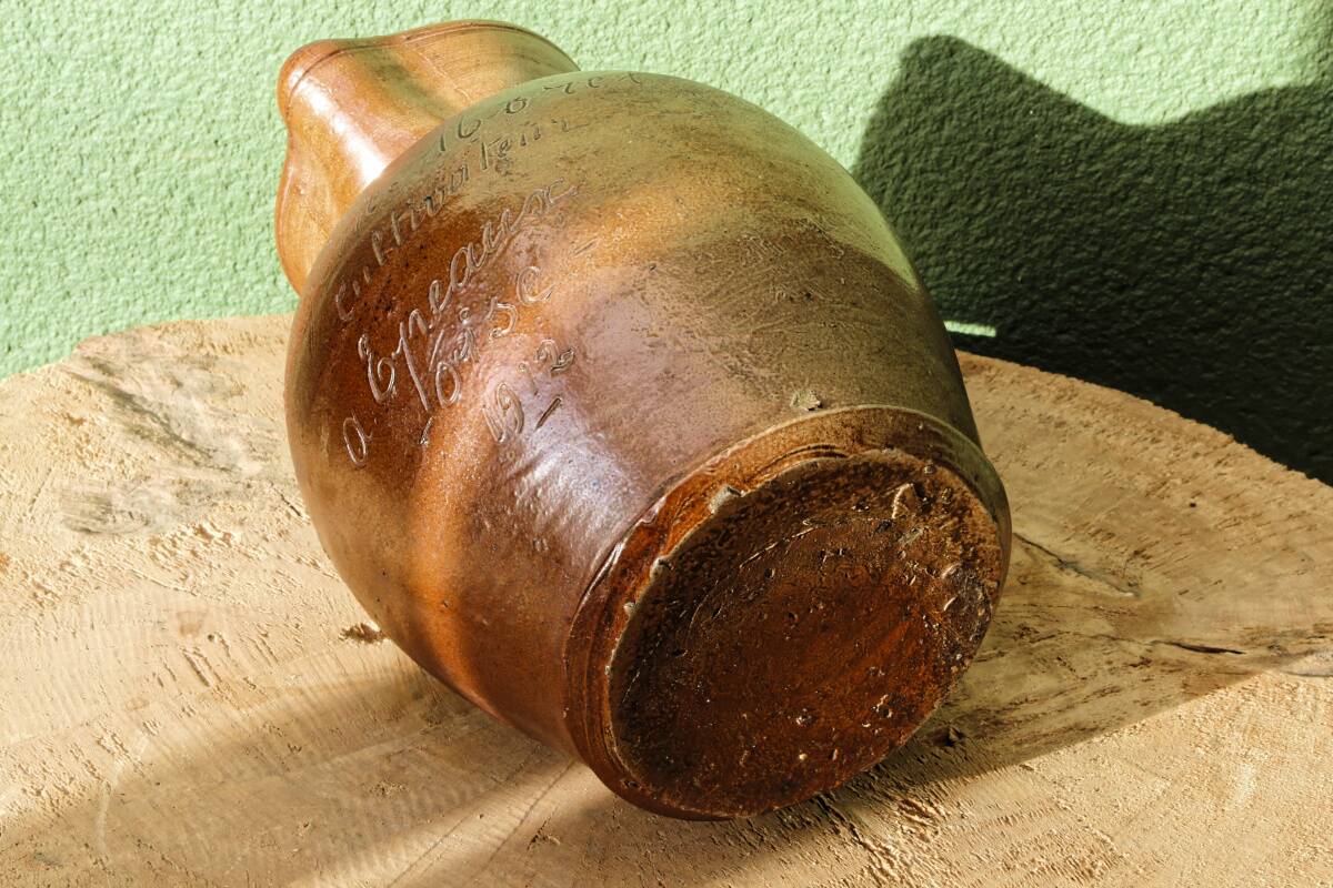 Large stoneware jug with a family name pattern, 1912