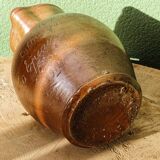Large stoneware jug with a family name pattern, 1912