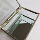 Jewelry box in bevelled glass and gold metal
