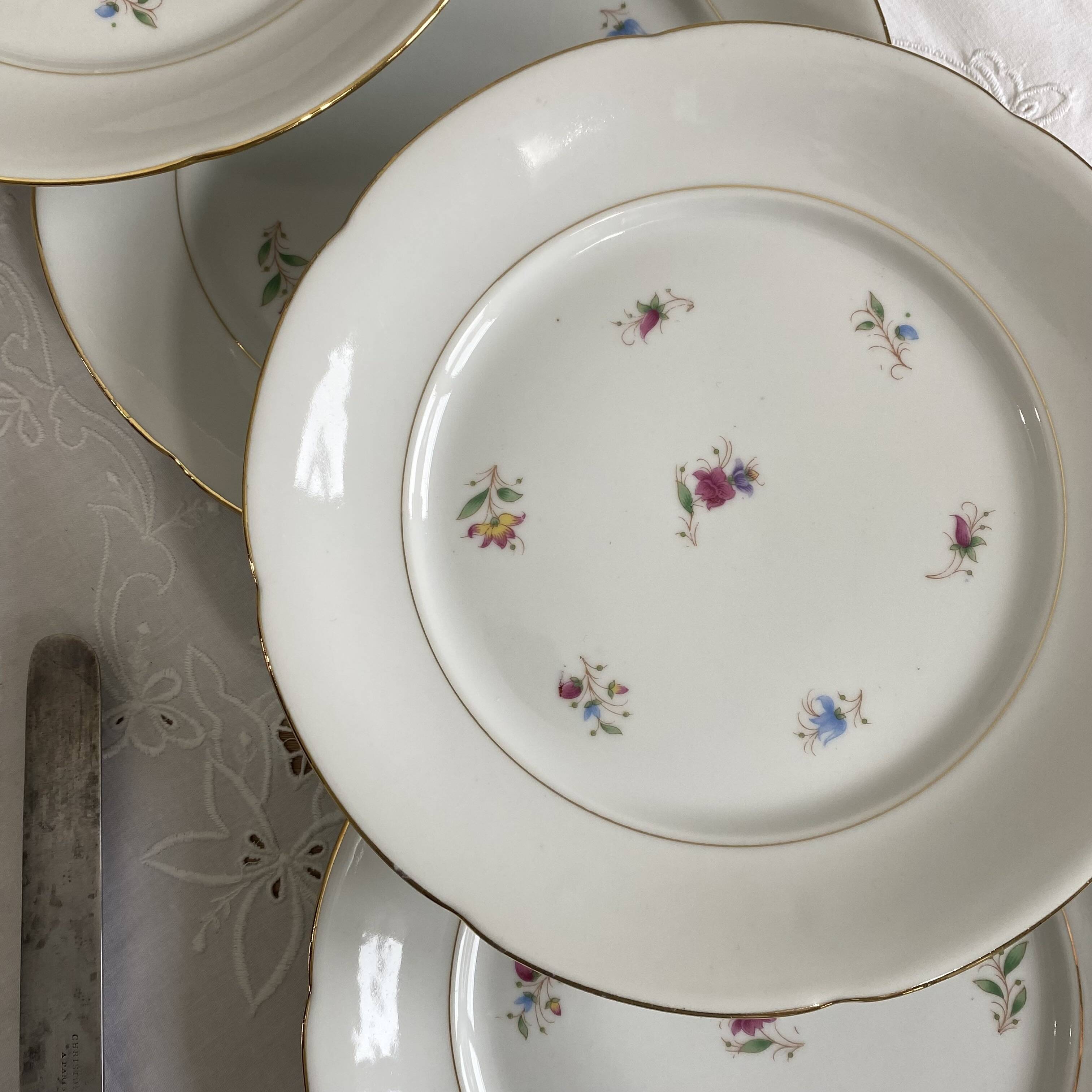 6 flat plates, antique porcelain with flowers and gilding, P L Limoges.