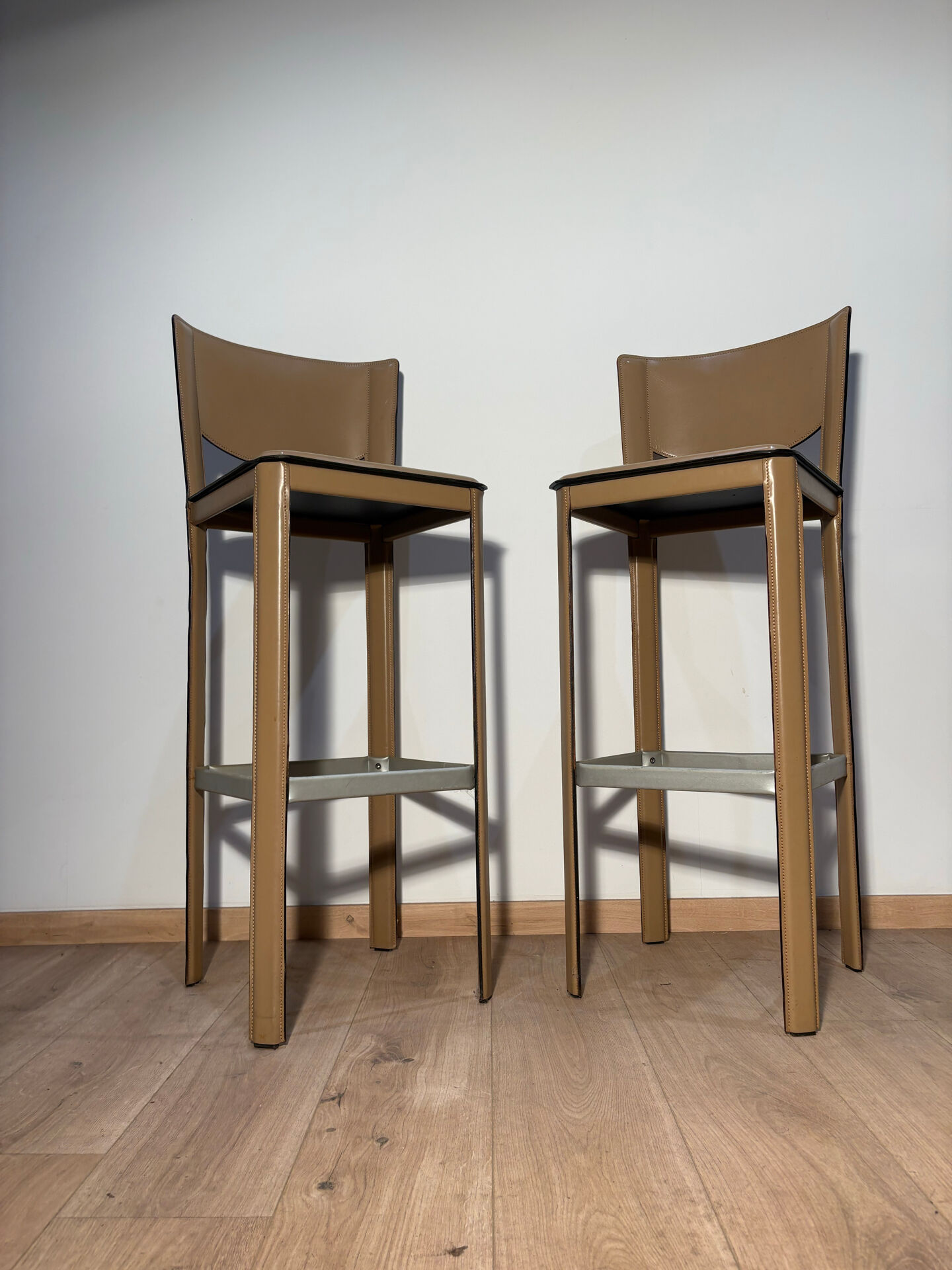 Pair of leather stools Enrico Pellizoni