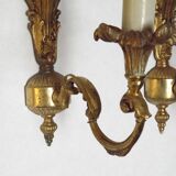 Pair of simple vintage French wall sconces in Art Nouveau bronze with leaf-shaped details.