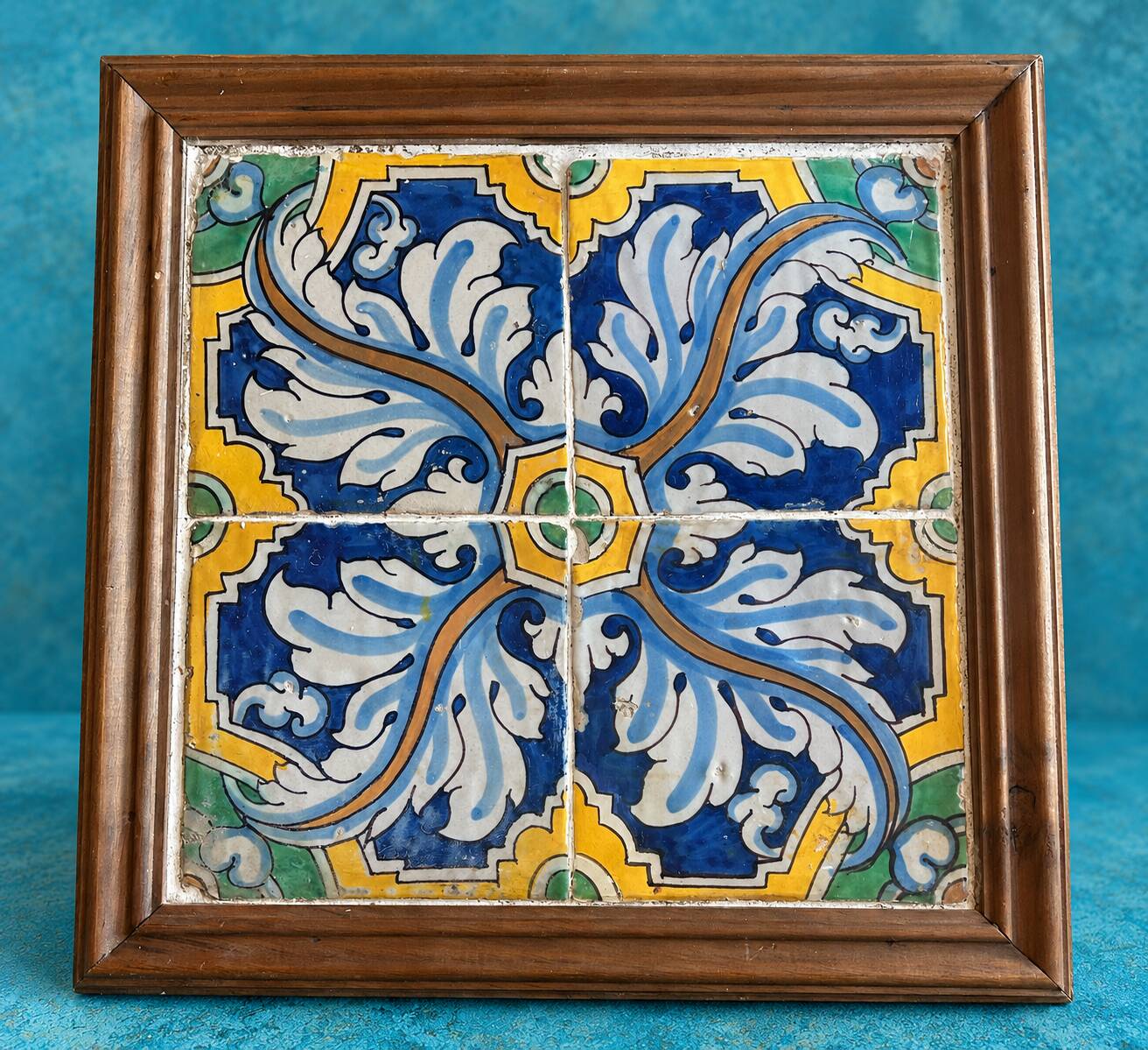 Panel of four Catalan tiles, 17th century, framed.