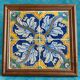 Panel of four Catalan tiles, 17th century, framed.