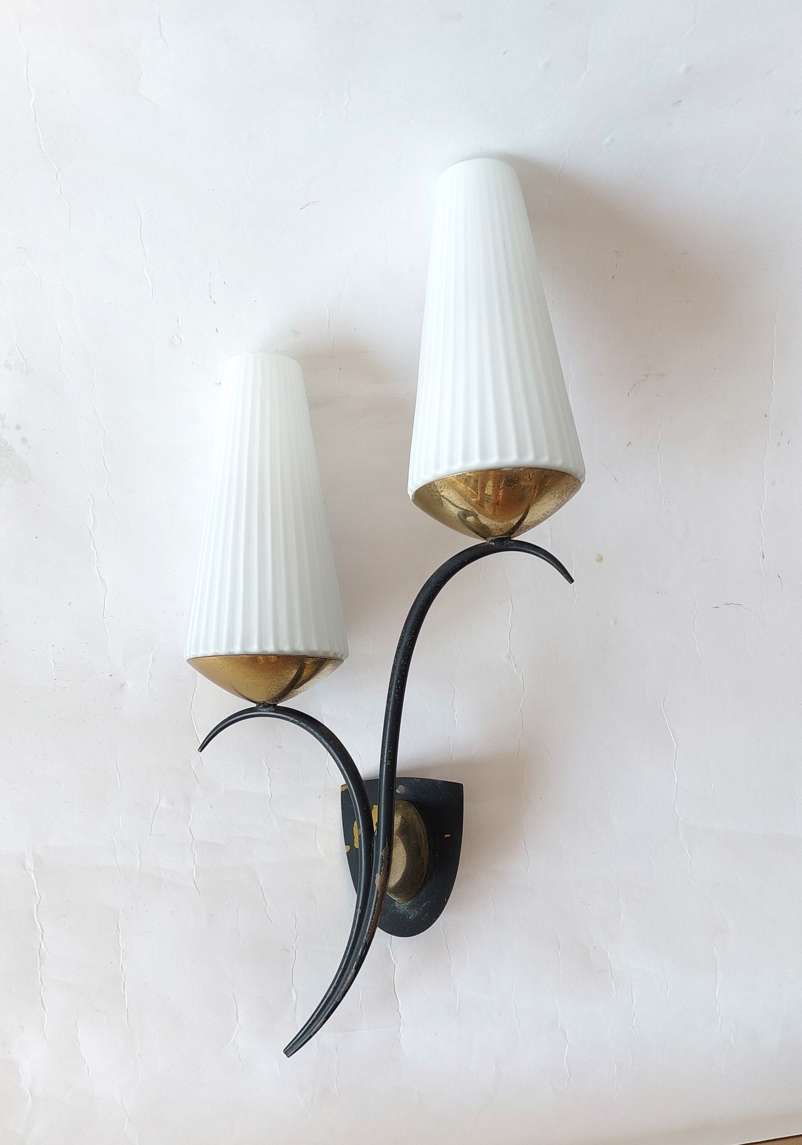 Wall lamp in black metal and gilded brass 1960 with two lights.