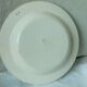 CHOISY HOLLOW PLATE IN FINE FAIENCE ON THE THEME OF THE MONTHS "APRIL"