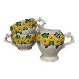 Sunflower flower cups and milk jug