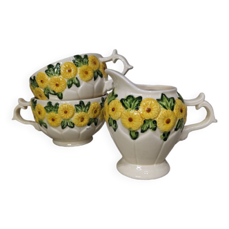 Sunflower flower cups and milk jug