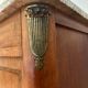 Antique bedside table in wood and marble – adorned with gilded brass ornaments –